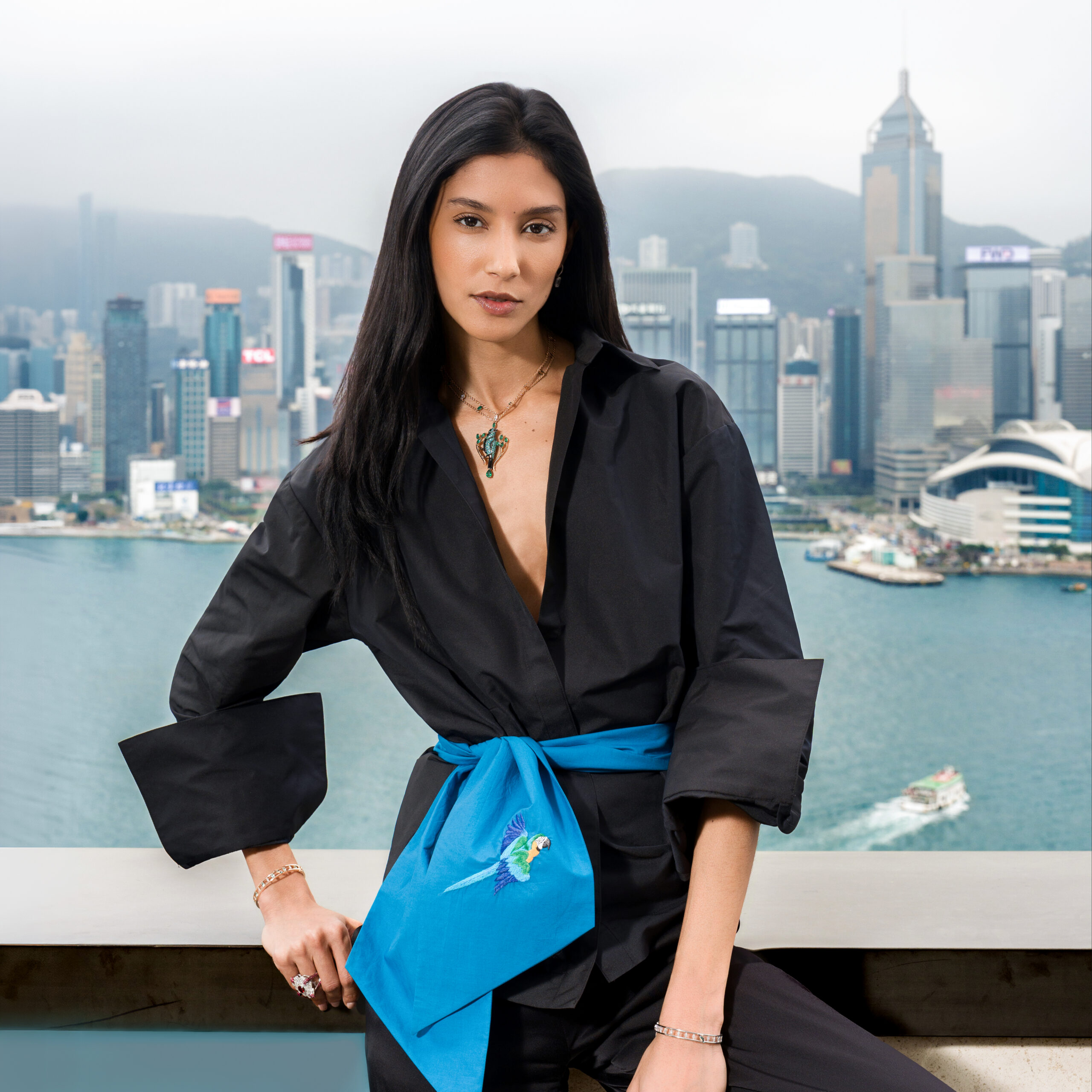photograph of woman in front of the hong kong skyline by Alexander Taptsov Photography, a local hong kong photographer