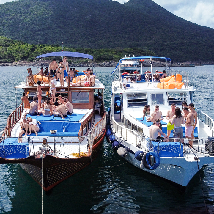 hong kong best junk boat compaies; HK Junks, two junk boats filled with people