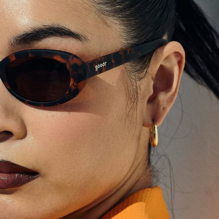 asian woman wearing goodr sunglasses