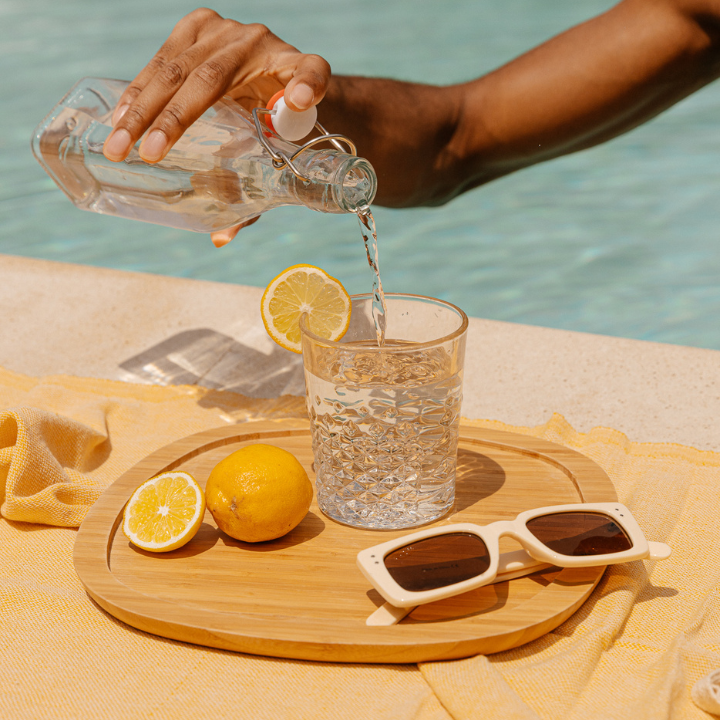 pouring lemon water beside the pool in hong kong summer