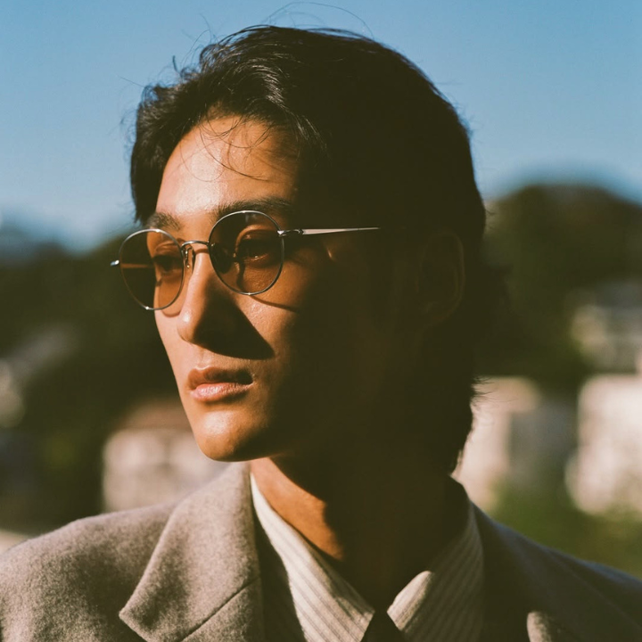 asian man wearing JINS sunglasses