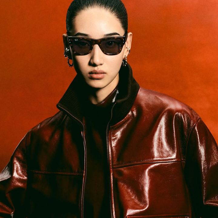 asian woman wearing ray bans sunglasses