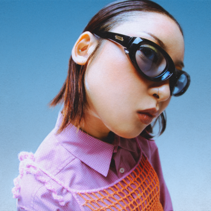 asian woman wearing sunglasses in hong kong